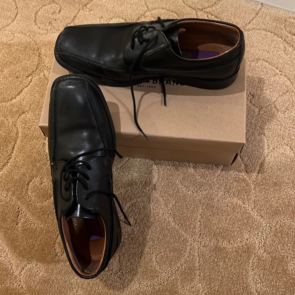 Left and right black party shoes for boys